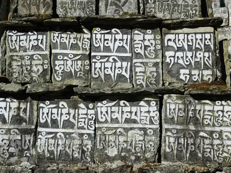 Mani stones carved with Buddhist prayers
